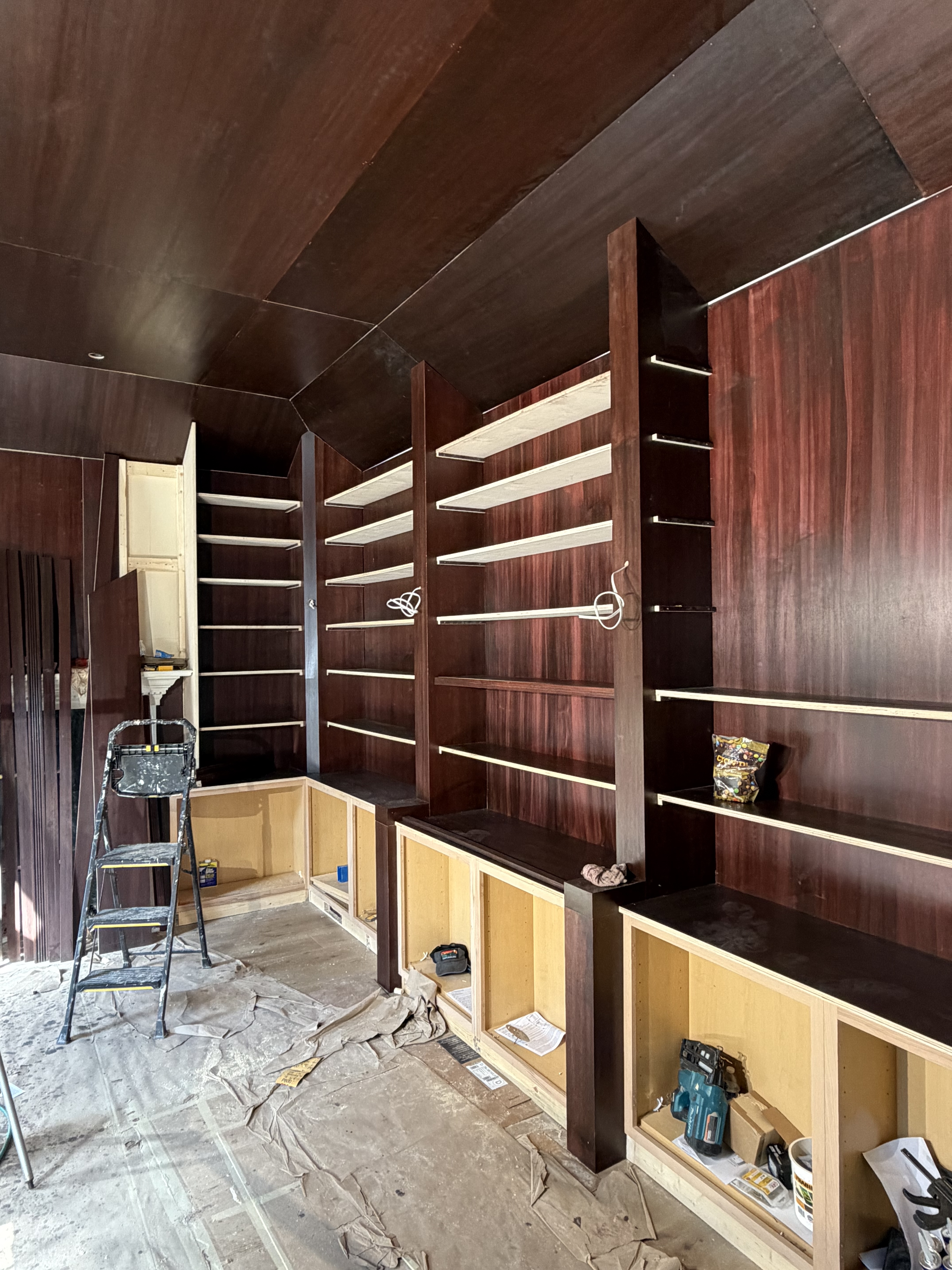 Custom library floor-to-ceiling built-in shelving