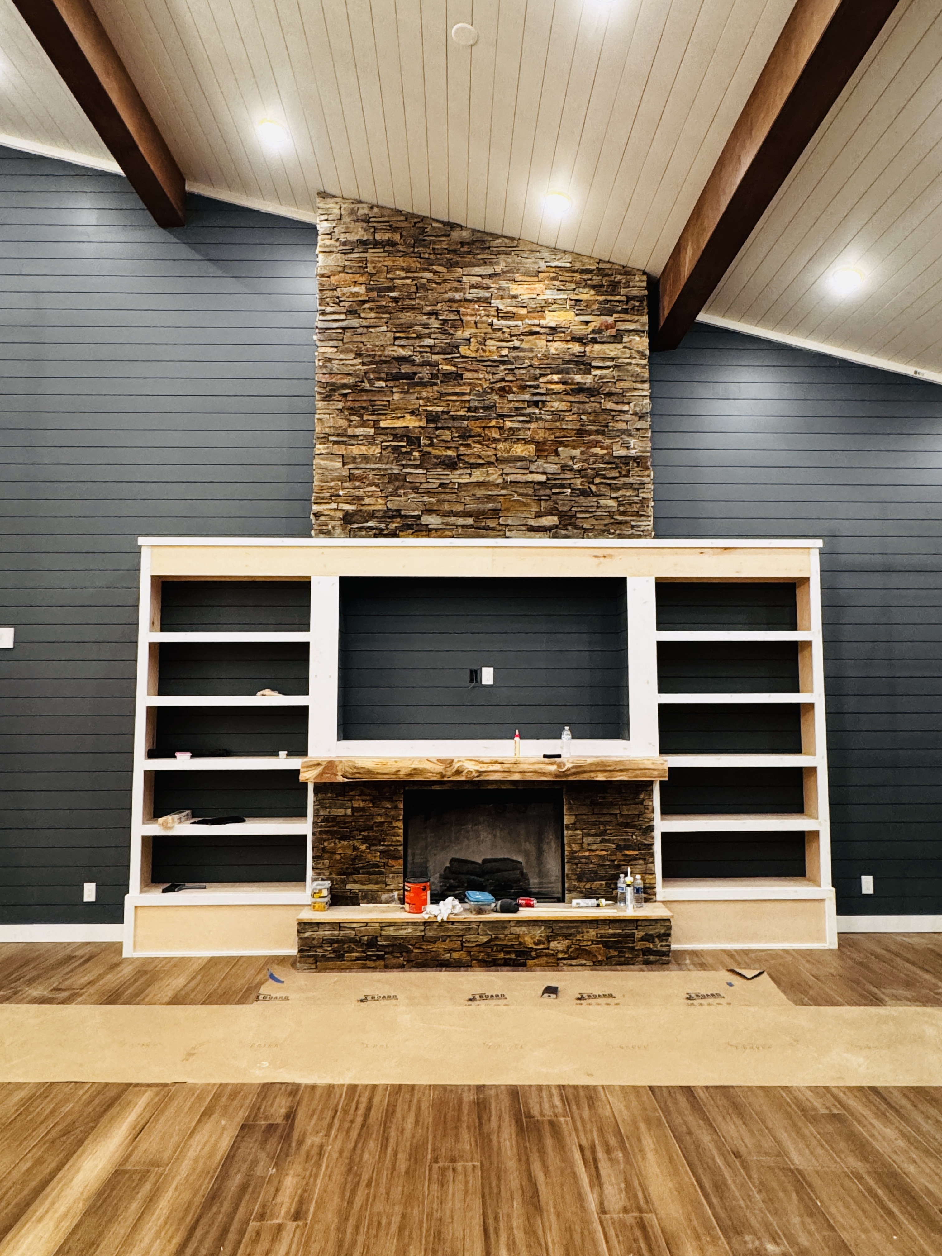 Custom entertainment wall with fireplace surround and shiplap
